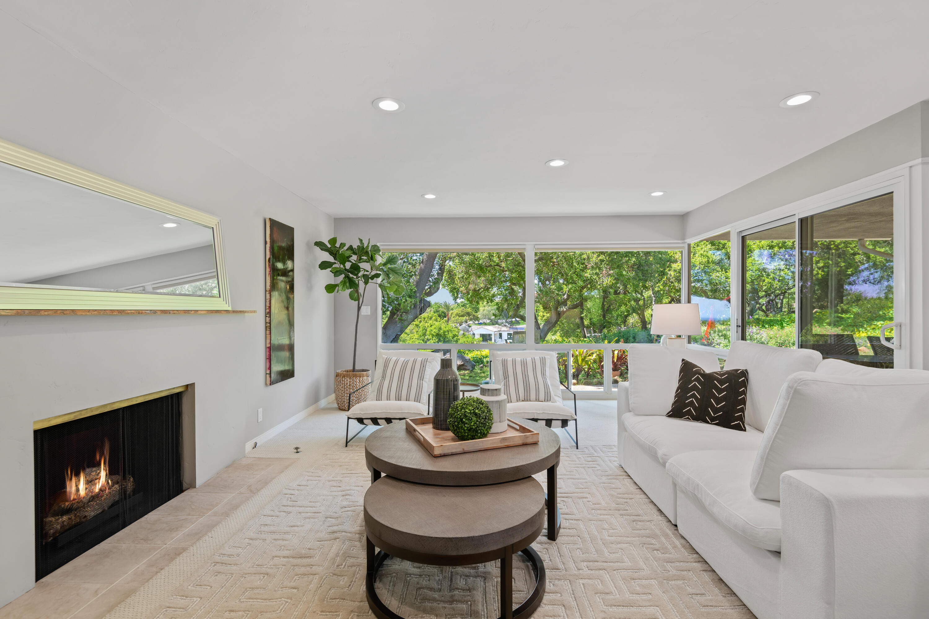 599 Mountain Drive Santa Barbara, CA 93103 - Photo 3 of 11 a living room with furniture and a fireplace