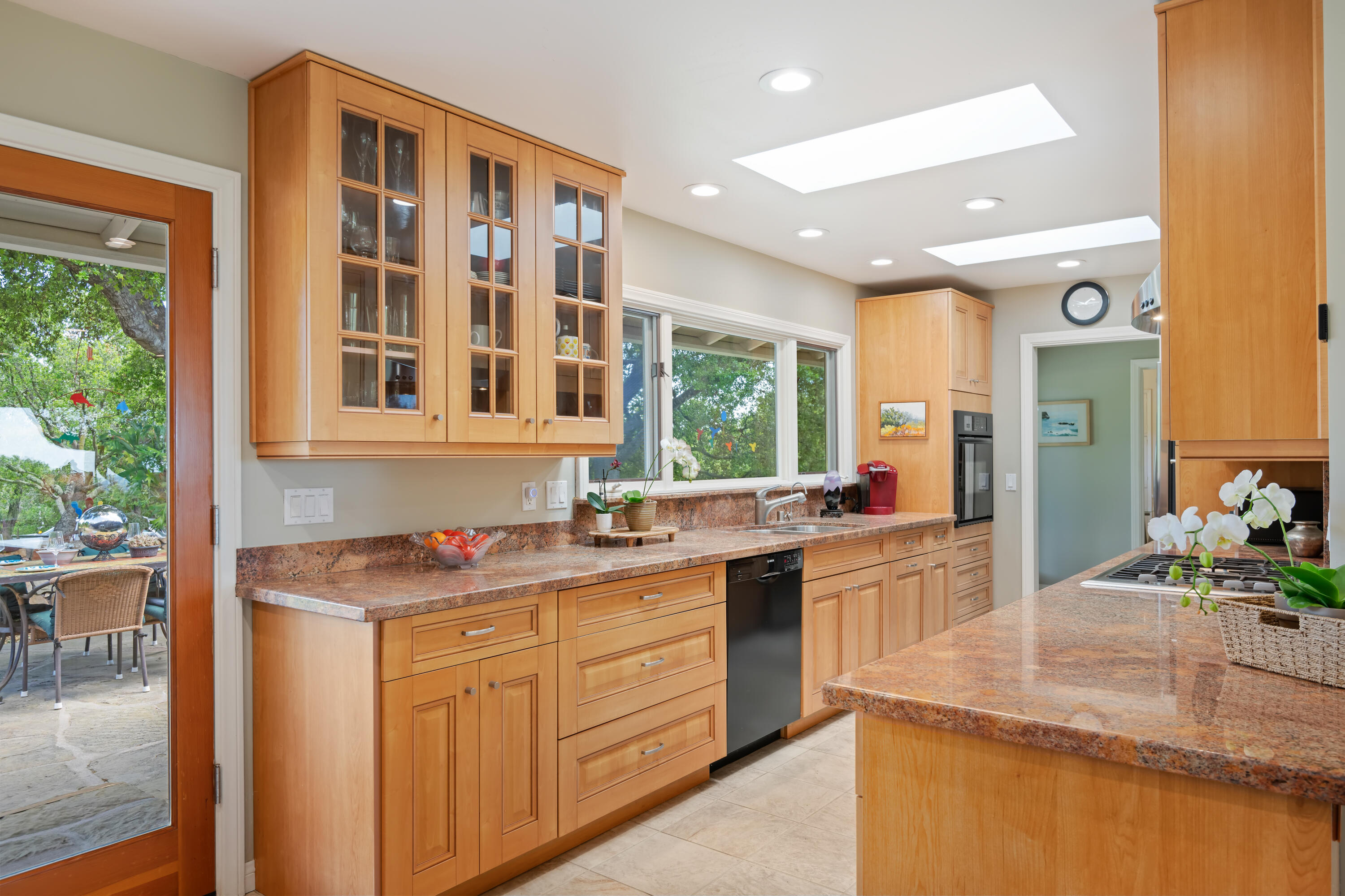 599 Mountain Drive Santa Barbara, CA 93103 - Photo 5 of 11 a kitchen with a sink stove and cabinets