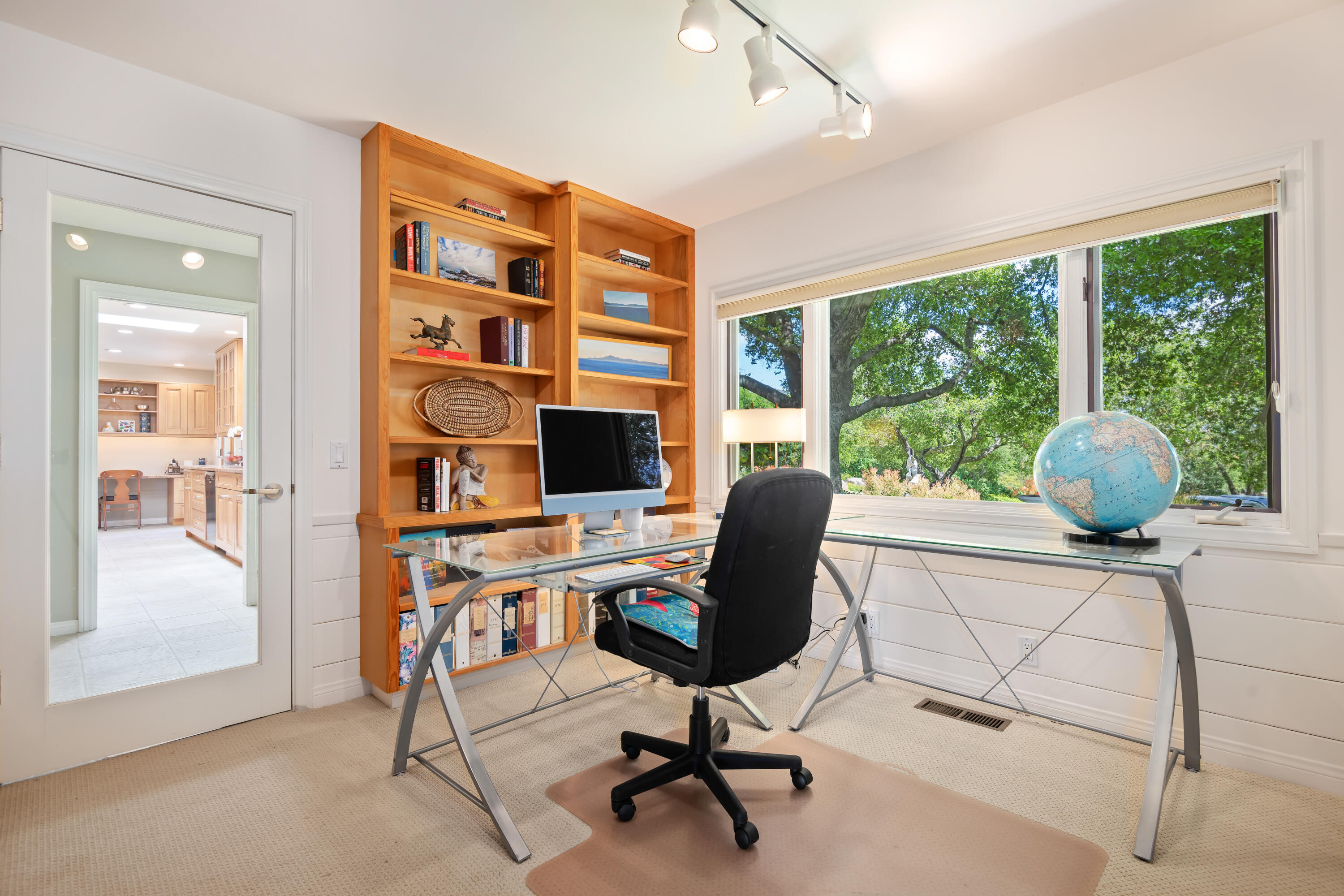 599 Mountain Drive Santa Barbara, CA 93103 - Photo 8 of 11 a view of a workspace with furniture and a window