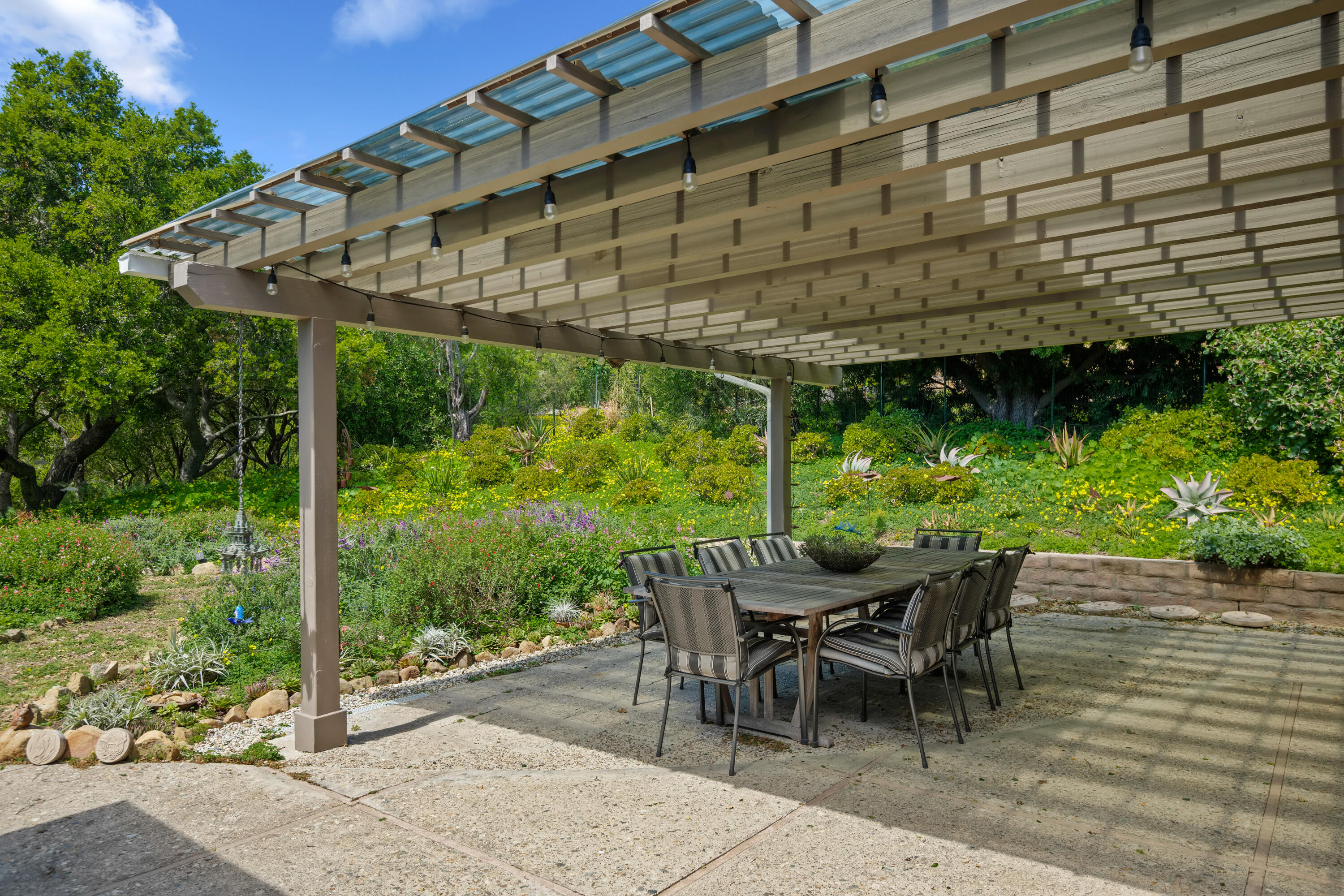 599 Mountain Drive Santa Barbara, CA 93103 - Photo 10 of 11 a patio with glass top table and chairs