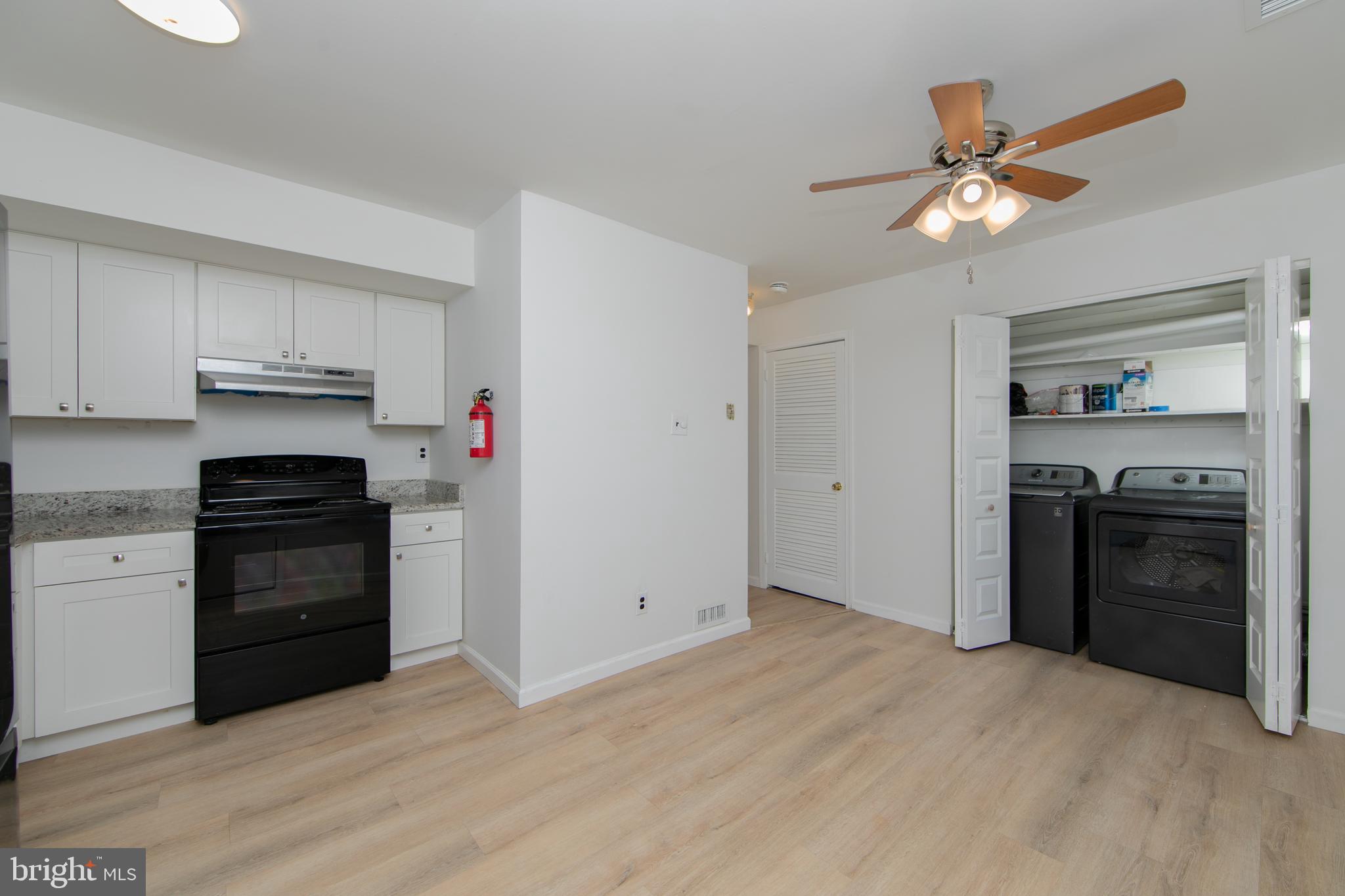 1042 Central Avenue Runnemede, NJ 08078 - Photo 12 of 36 a kitchen with a refrigerator and a stove top oven
