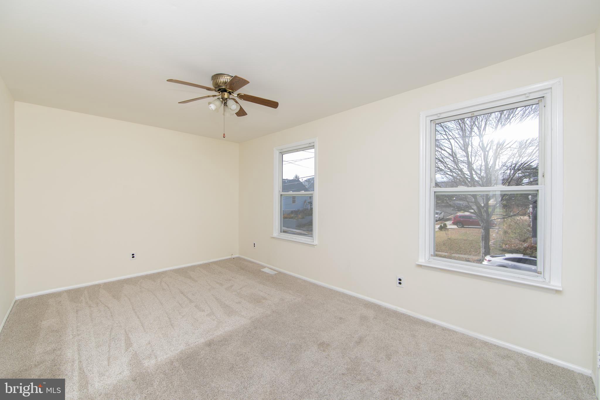 1042 Central Avenue Runnemede, NJ 08078 - Photo 17 of 36 an empty room with windows and fan