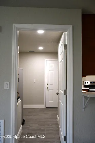 a kitchen with a refrigerator a sink and a stove