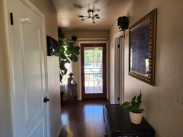 a view of entryway with wooden floor