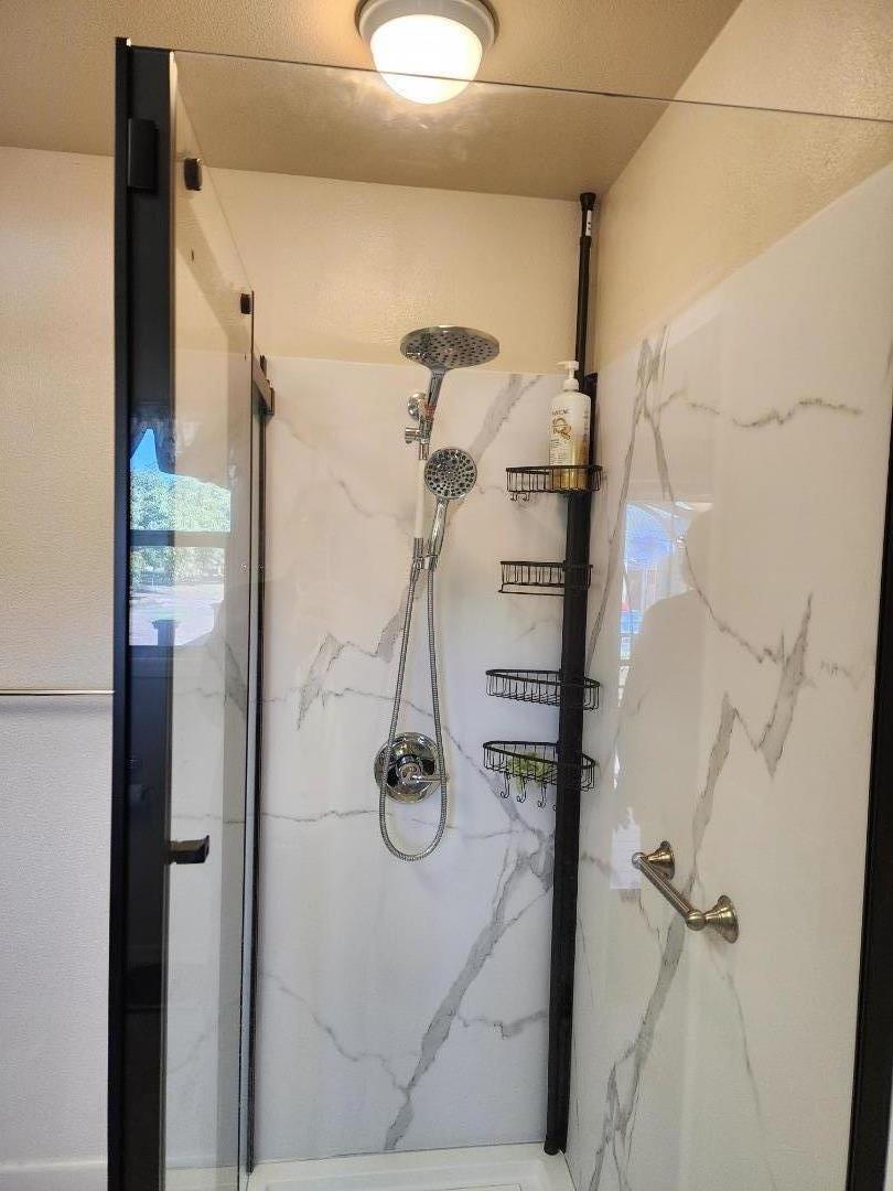 3719 North Hart Road Modesto, CA 95358 - Photo 21 of 43 a bathroom with a shower