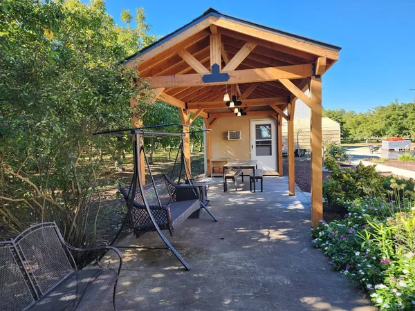 a view of a chair and table in the patio