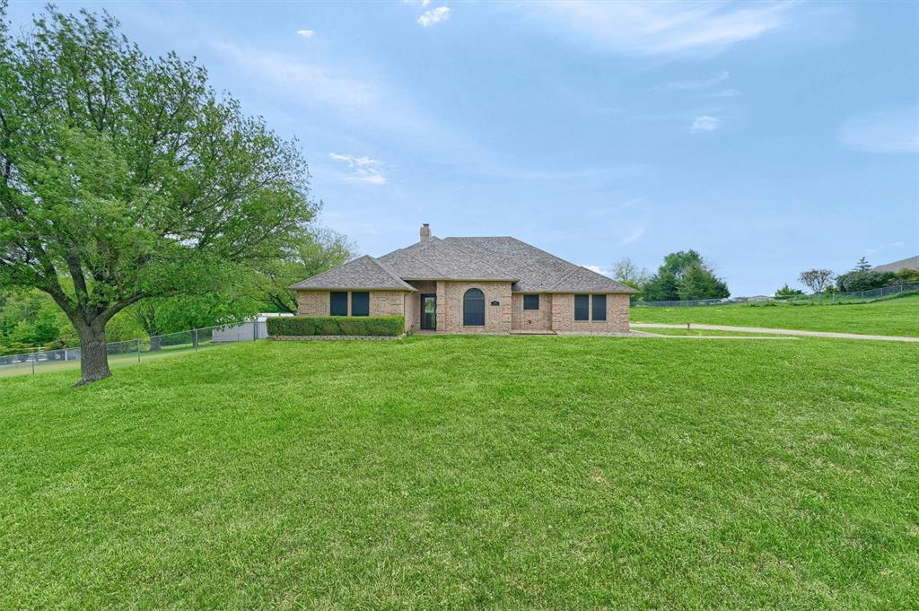 107 Golden Road Sherman, TX 75090 - Photo 1 of 1 Welcome Home to 107 Golden Road, Sherman TX Single story home featuring fence, a chimney, brick siding, and a front yard