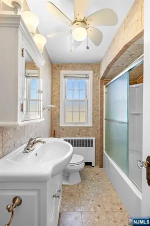 a bathroom with a sink and mirror