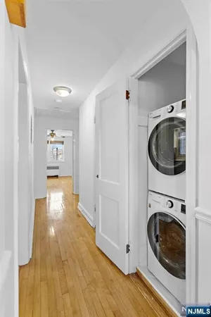 a view of a hallway with washer and dryer