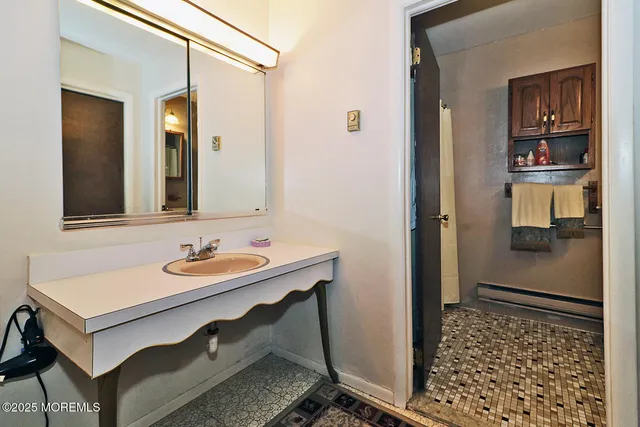 a bathroom with a sink and a mirror