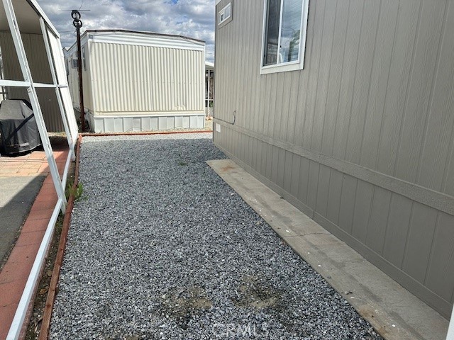43601 East Florida Avenue, Unit 98 Hemet, CA 92544 - Photo 4 of 16 a view of an empty room with wooden floor and a window