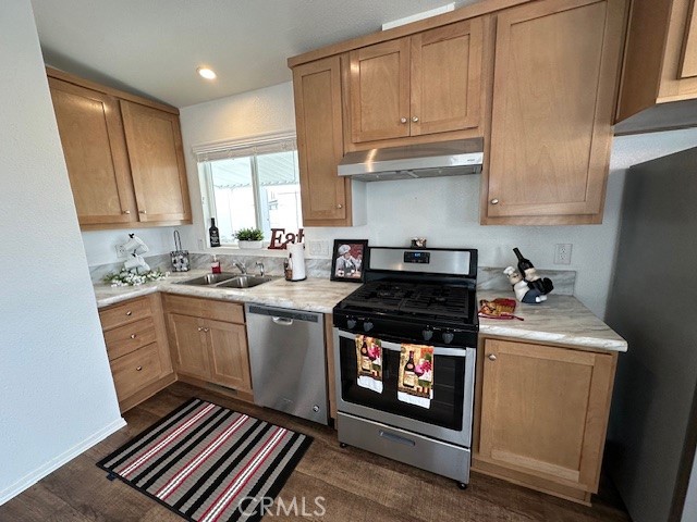43601 East Florida Avenue, Unit 98 Hemet, CA 92544 - Photo 8 of 16 a kitchen with stainless steel appliances a stove a sink and cabinets