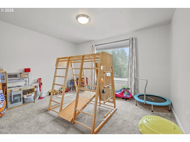 a living room with furniture a air conditioner vent and a window