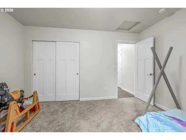a living room with a furniture and a rug