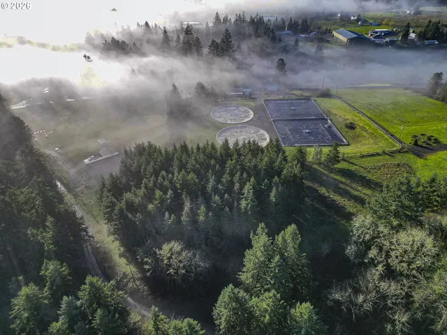 a aerial view of a house with a yard
