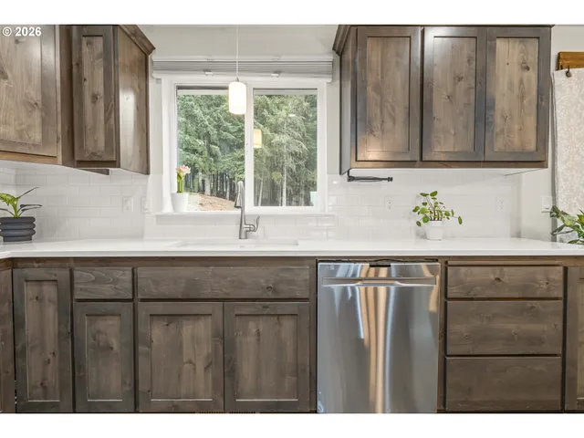a kitchen with a sink and a window