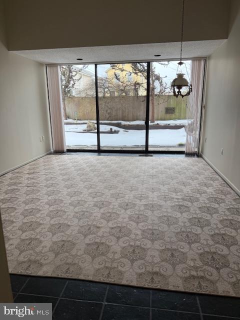 1 Markham Road, Unit 1D Princeton, NJ 08540 - Photo 10 of 55 a view of an empty room with floor to ceiling windows