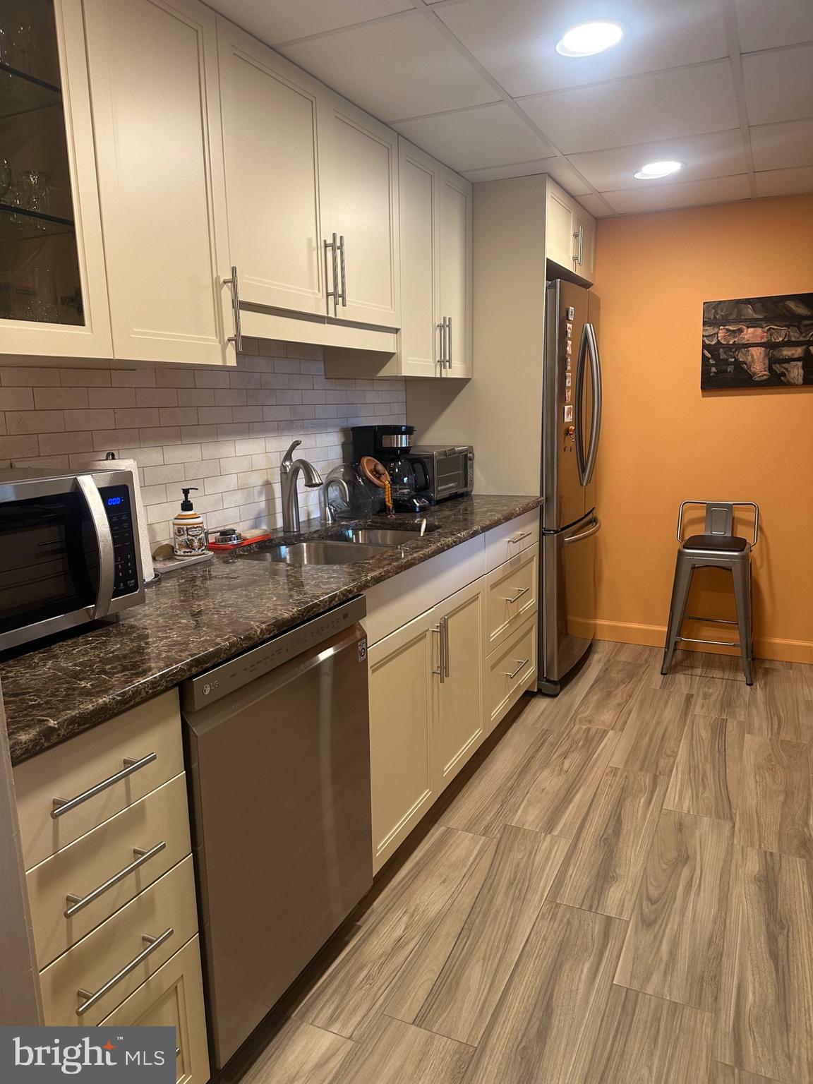 1 Markham Road, Unit 1D Princeton, NJ 08540 - Photo 13 of 49 a kitchen with stainless steel appliances granite countertop a sink a stove and refrigerator