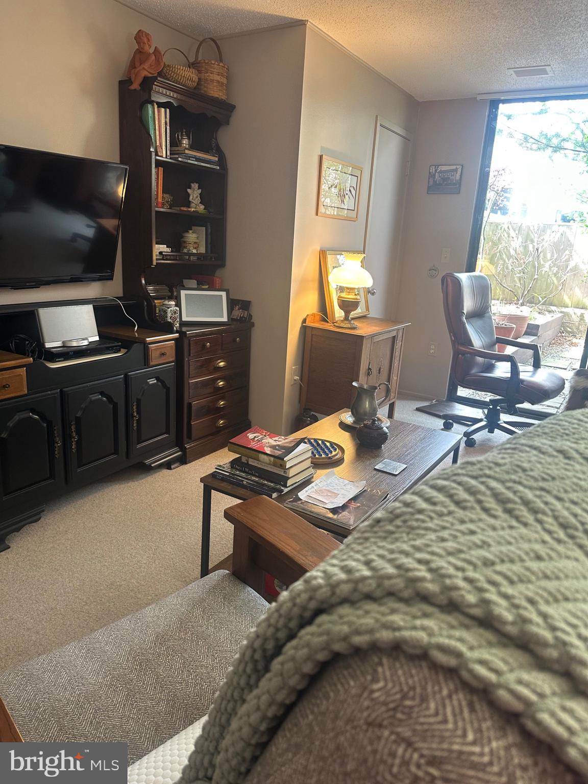 1 Markham Road, Unit 1D Princeton, NJ 08540 - Photo 16 of 49 a workspace with furniture window and a flat screen tv