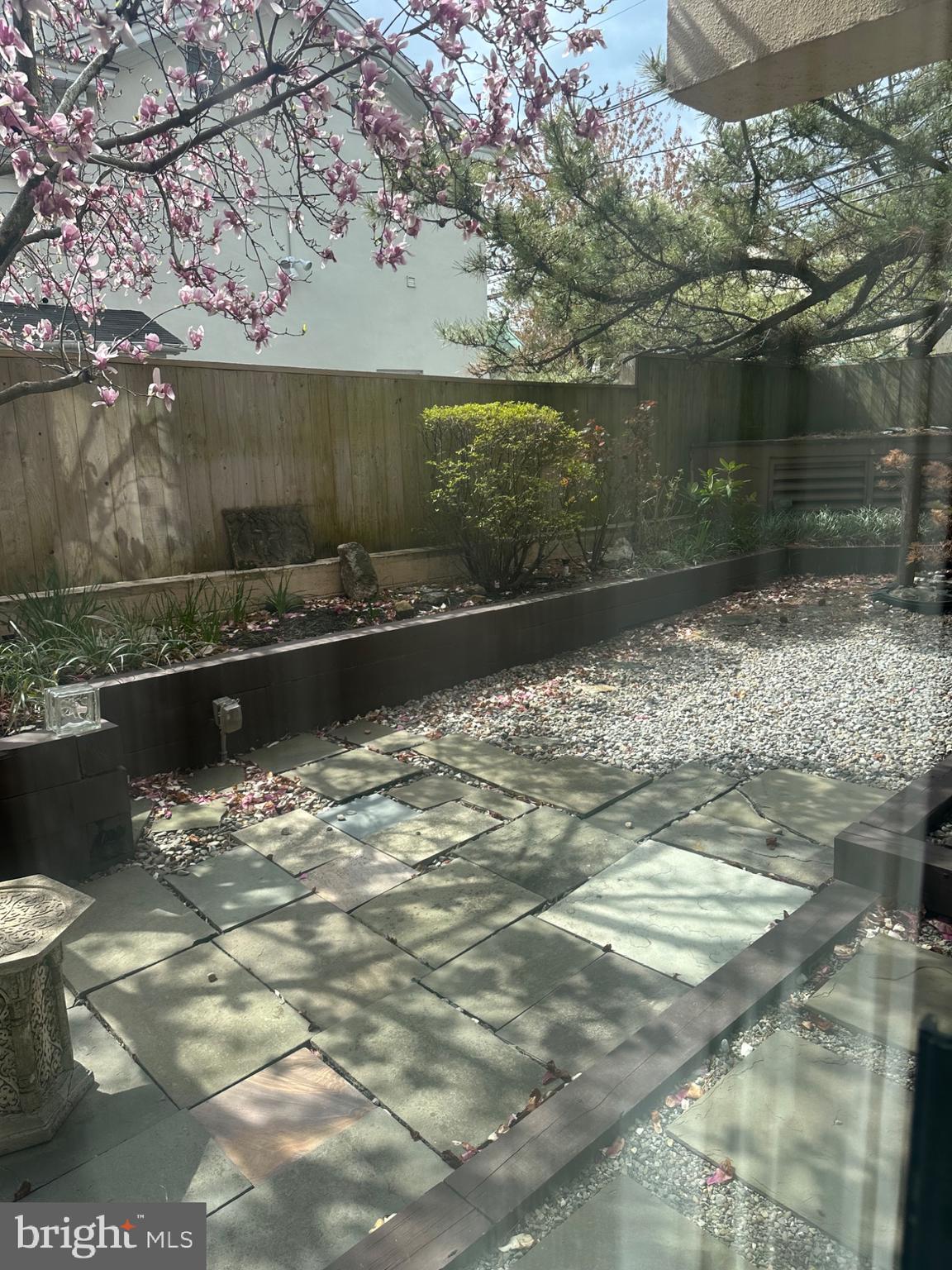 1 Markham Road, Unit 1D Princeton, NJ 08540 - Photo 25 of 49 a backyard of a house with lots of green space and fountain