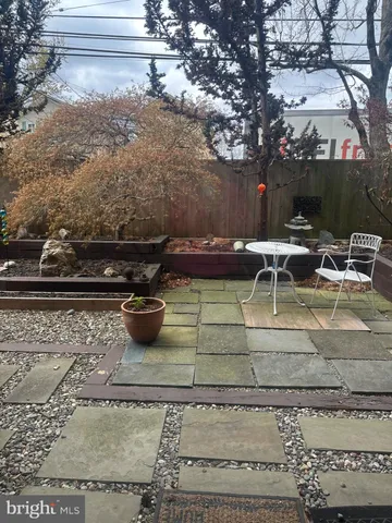 a view of a yard with outdoor seating