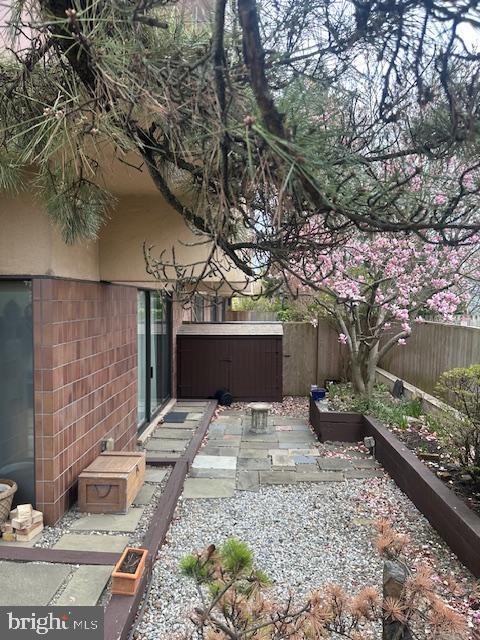 1 Markham Road, Unit 1D Princeton, NJ 08540 - Photo 3 of 52 Serene garden retreat with blooming trees.