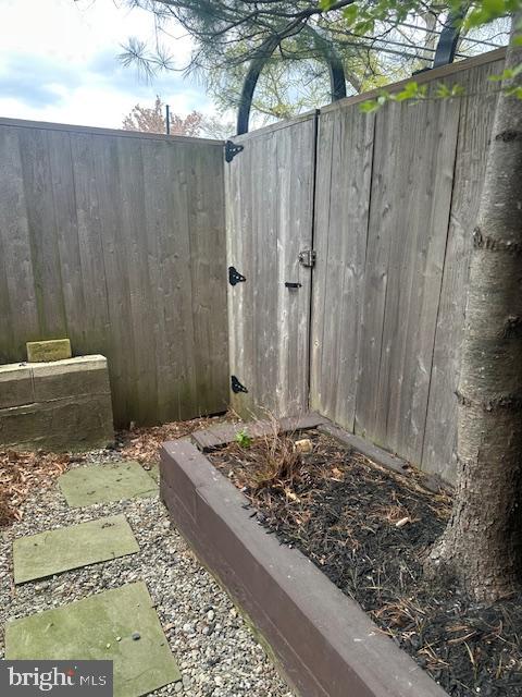 1 Markham Road, Unit 1D Princeton, NJ 08540 - Photo 47 of 52 Secluded garden gate with rustic charm.