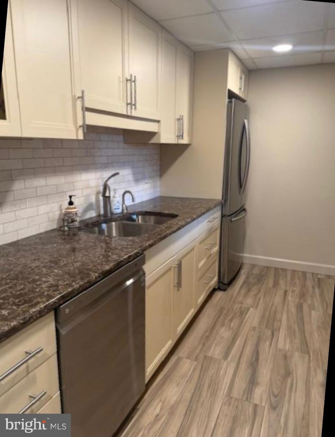1 Markham Road, Unit 1D Princeton, NJ 08540 - Photo 4 of 55 a kitchen with stainless steel appliances granite countertop a sink stove and refrigerator