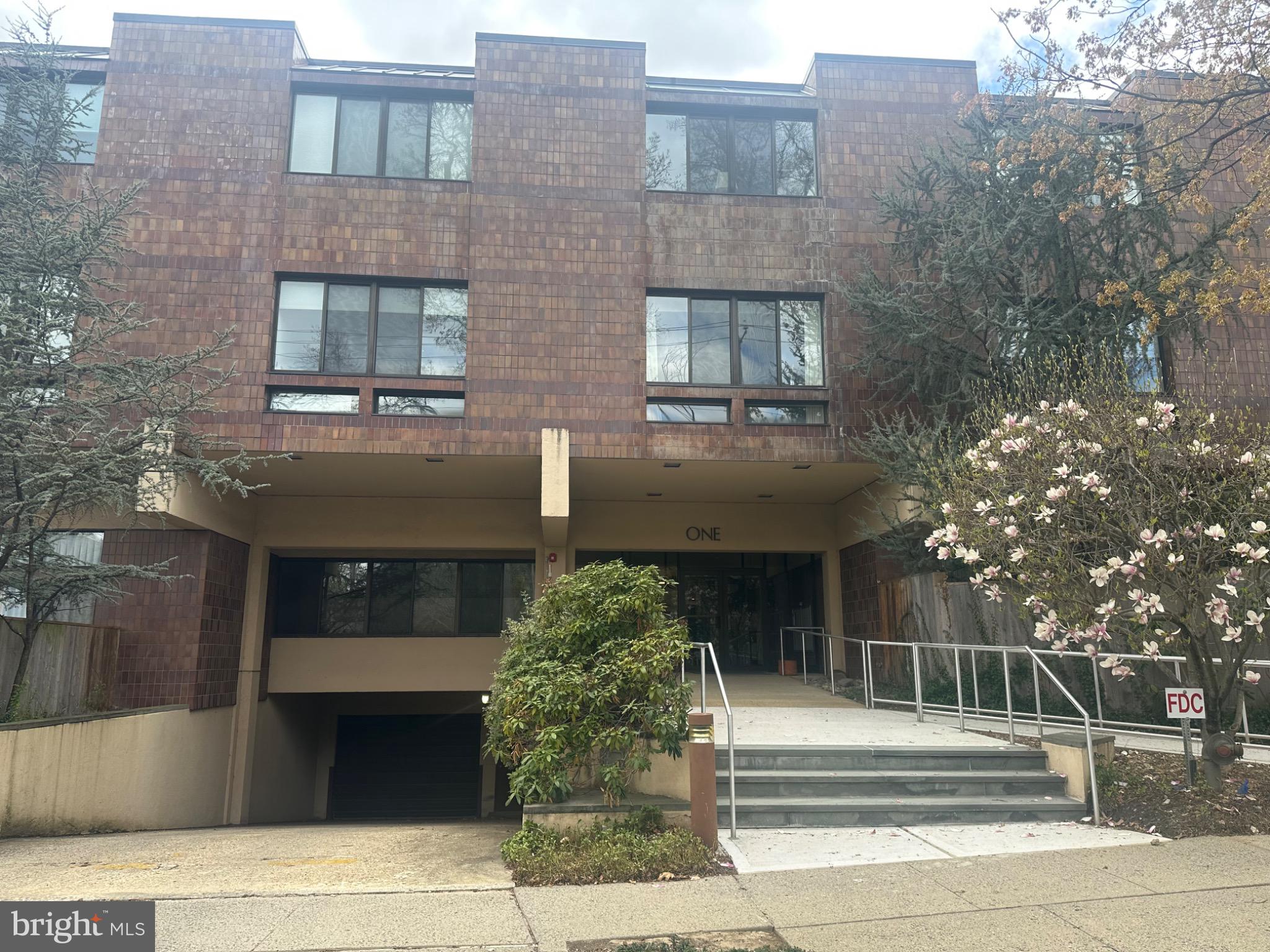 1 Markham Road, Unit 1D Princeton, NJ 08540 - Photo 7 of 52 Modern brick facade with inviting entrance.