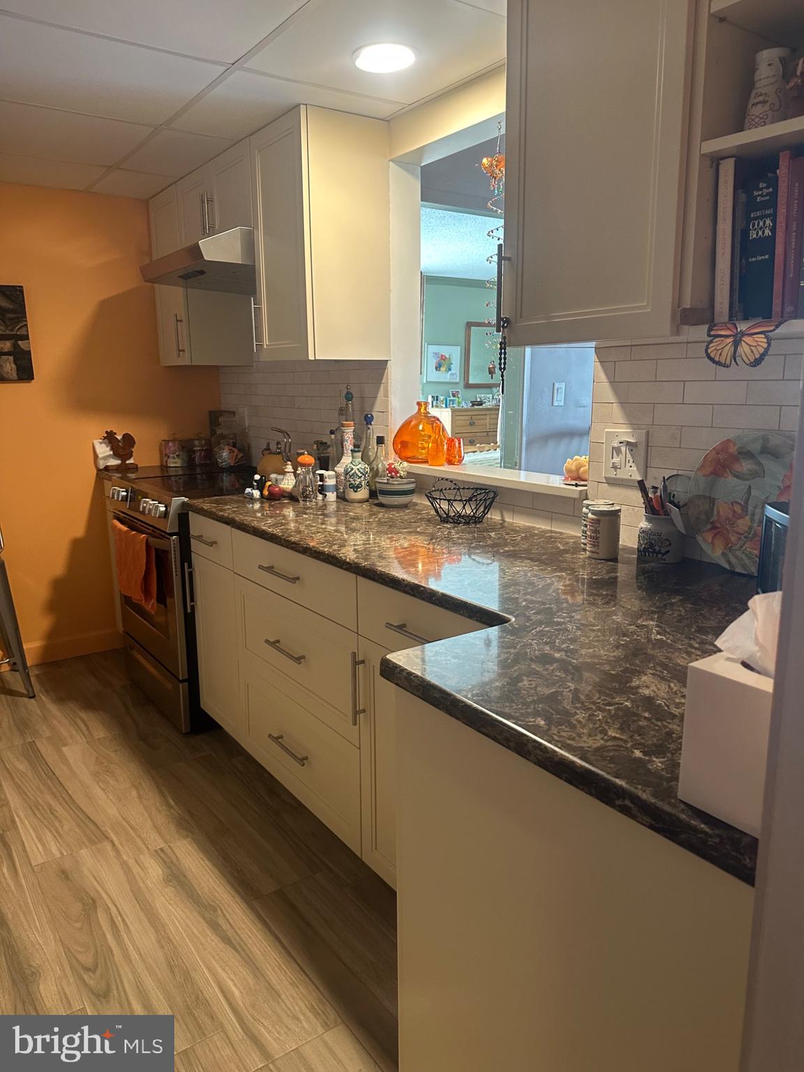 1 Markham Road, Unit 1D Princeton, NJ 08540 - Photo 10 of 49 a kitchen with stainless steel appliances granite countertop a sink stove and cabinets