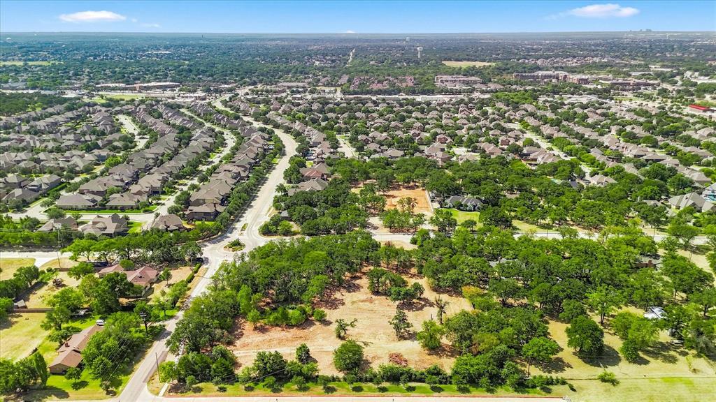 1347 Johnson Road Keller, TX 76248 - Photo 8 of 18 Expansive land parcel with abundant mature trees and undeveloped terrain, surrounded by established residential areas and roadways