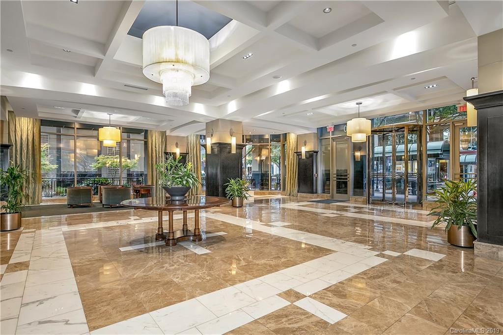 230 South Tryon Street, Unit 703 Charlotte, NC 28202 - Photo 18 of 22 a view of a lobby with chandelier