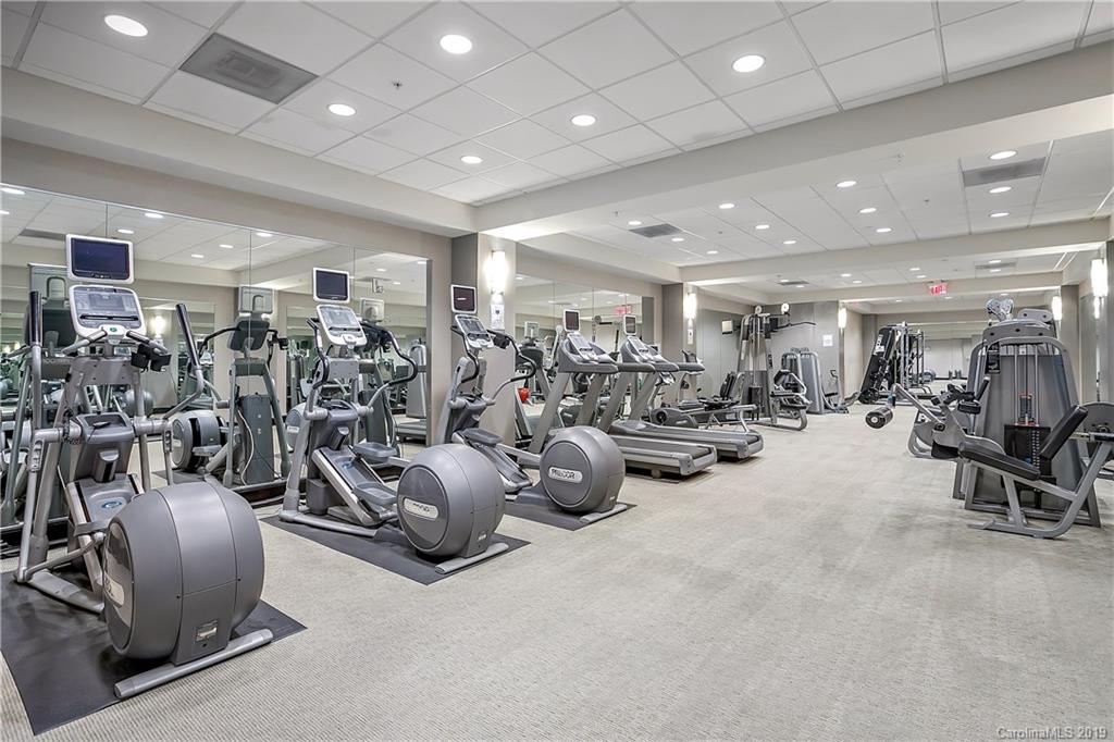 230 South Tryon Street, Unit 703 Charlotte, NC 28202 - Photo 20 of 22 a view of a room with gym equipment and a large window