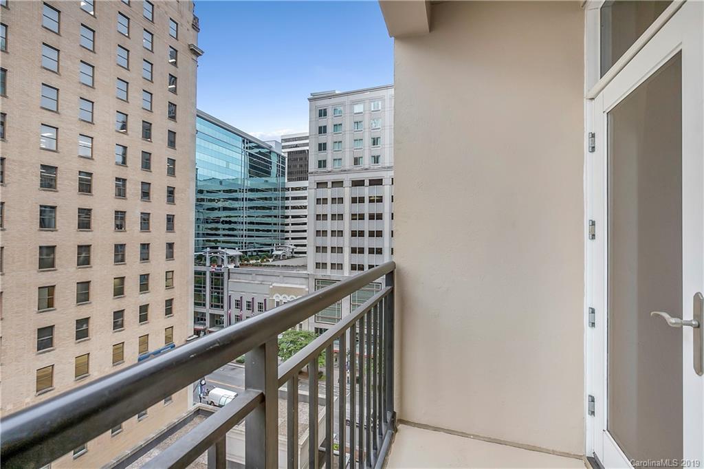230 South Tryon Street, Unit 703 Charlotte, NC 28202 - Photo 3 of 22 a view of a balcony with a couple of buildings