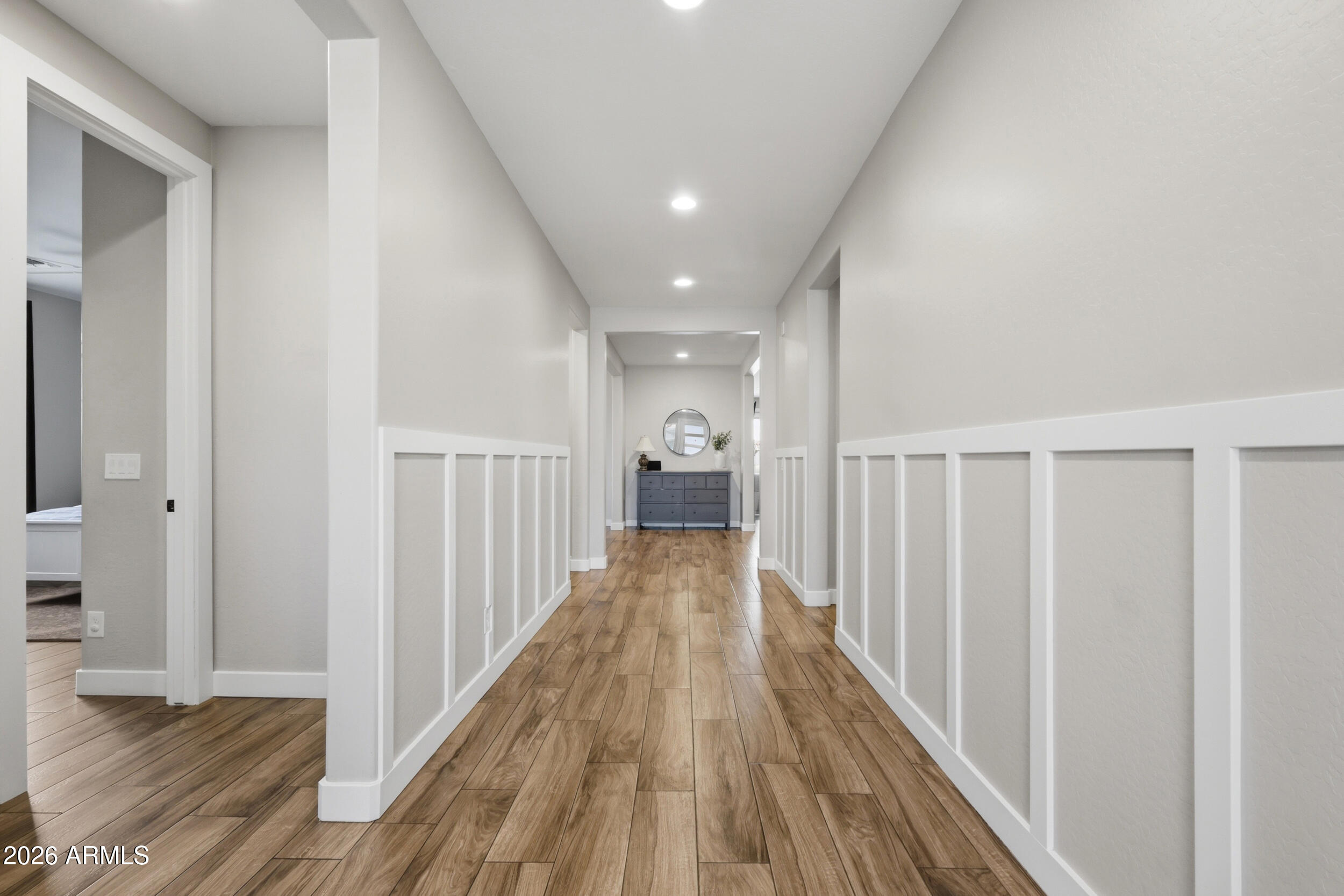 12517 West Lawrence Road Glendale, AZ 85307 - Photo 10 of 52 a view of a hallway with wooden floor