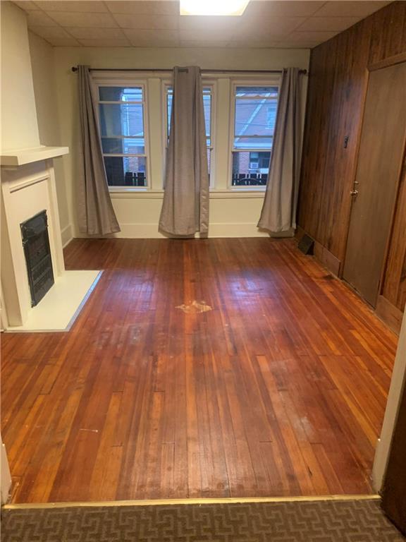 3312 Dawson Street Pittsburgh, PA 15213 - Photo 2 of 8 a view of a living room with wooden floor and staircase