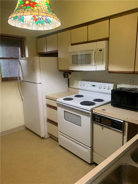 3312 Dawson Street Pittsburgh, PA 15213 - Photo 3 of 8 a kitchen with stainless steel appliances granite countertop a stove and a microwave