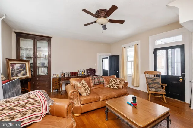 a large kitchen with stainless steel appliances a sink and cabinets