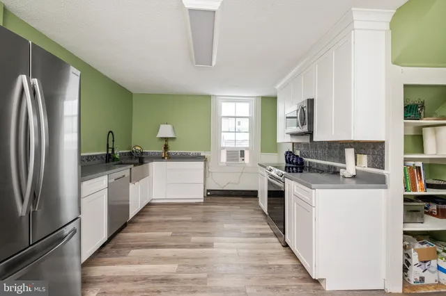 a kitchen with a stove and a microwave
