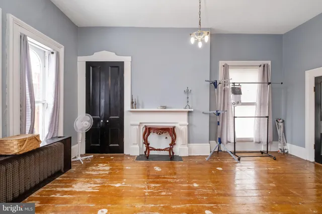 a bedroom with furniture and a rug