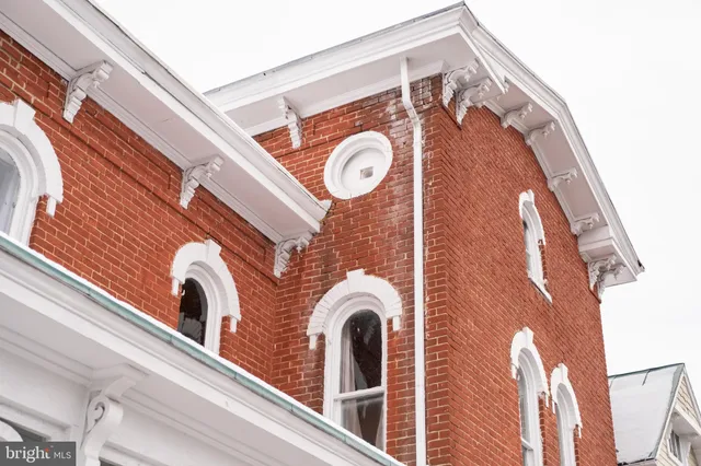 a front view of a house with a porch