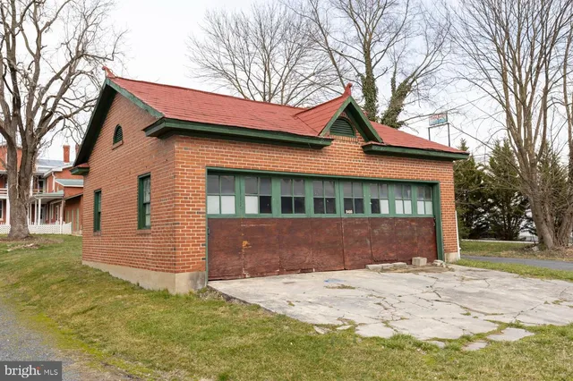 a view of swimming pool with a lounge chairs