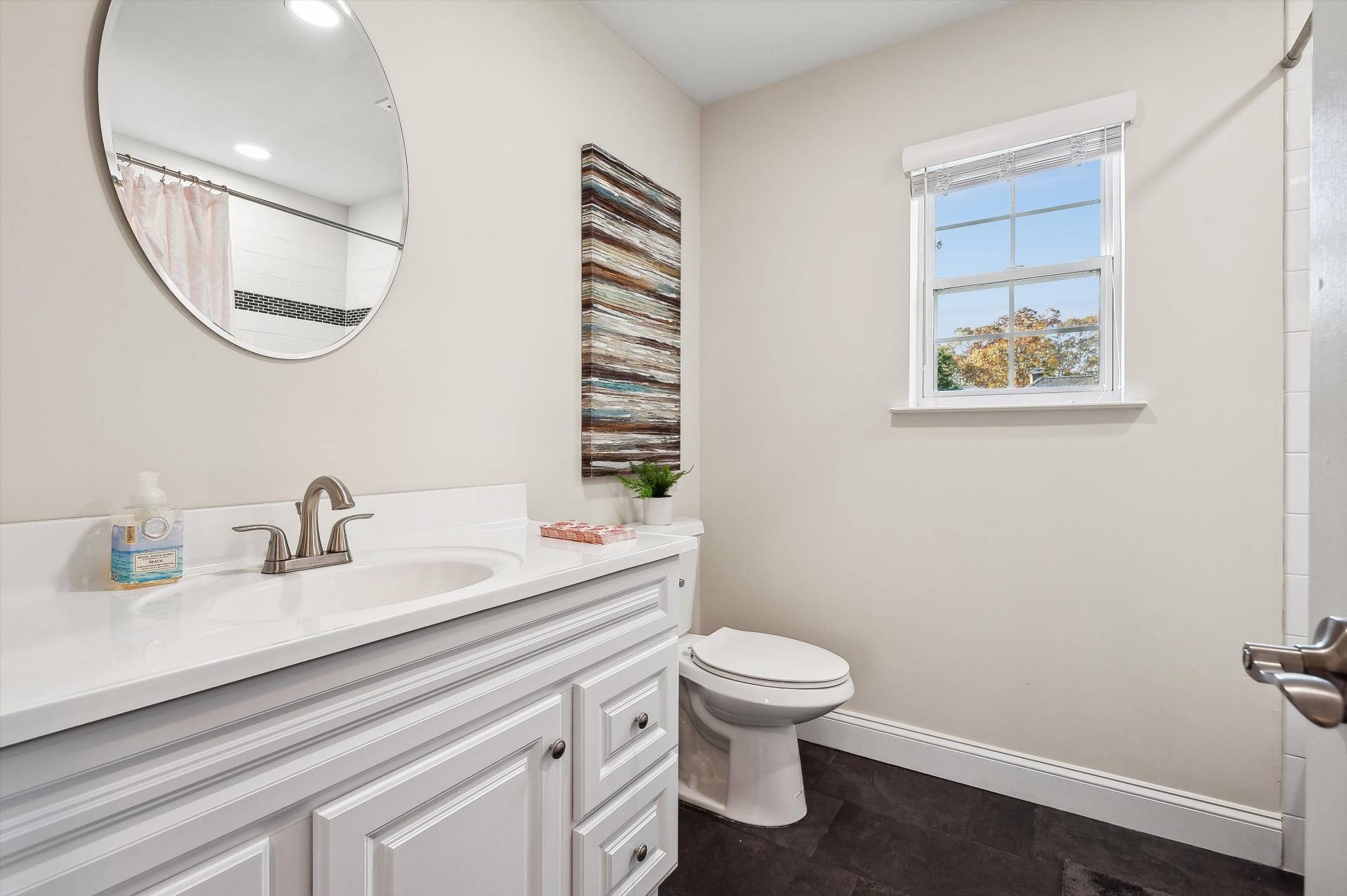 19 Summit Boulevard Westhampton, NY 11977 - Photo 21 of 38 a bathroom with a toilet a sink and mirror