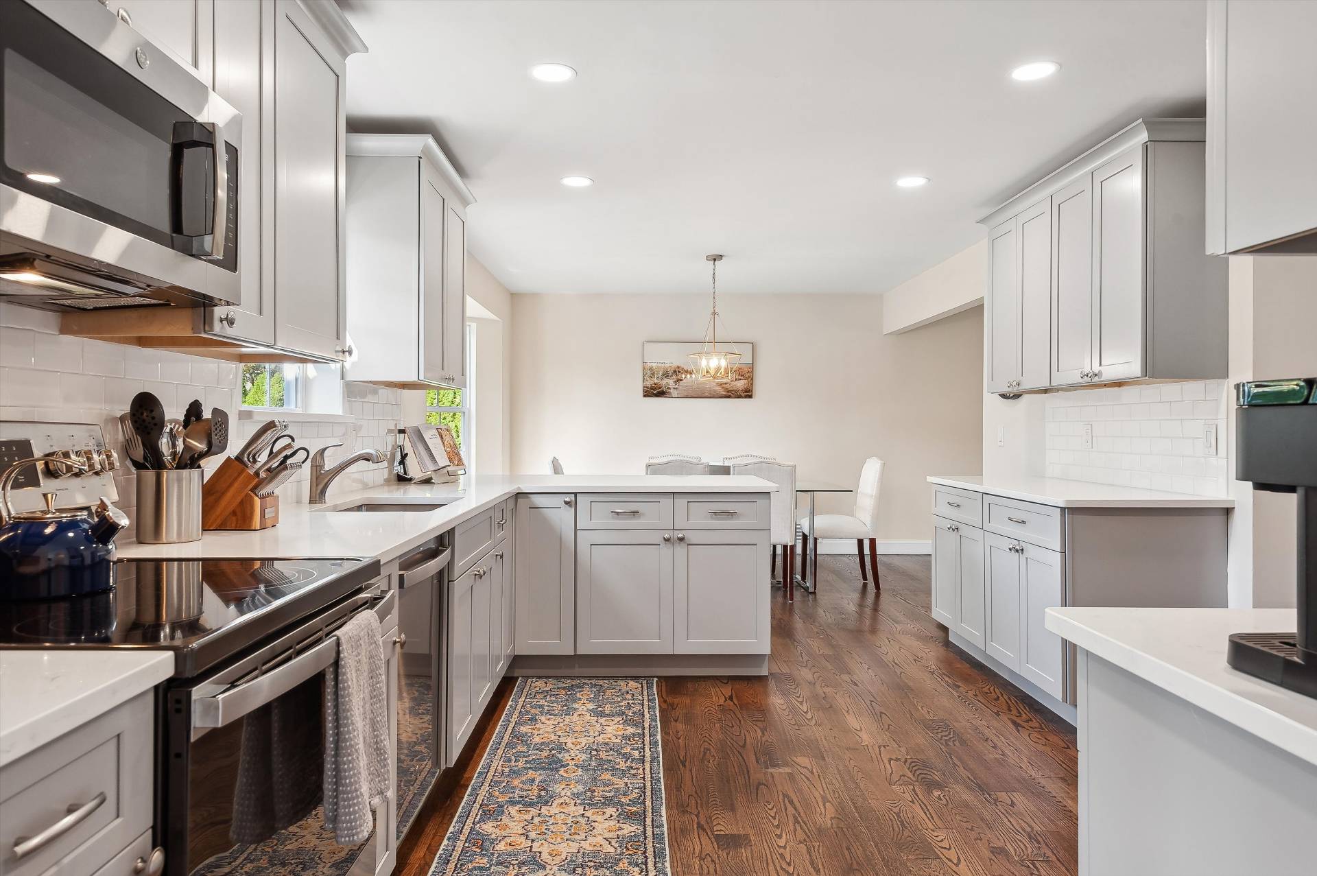 19 Summit Boulevard Westhampton, NY 11977 - Photo 38 of 38 a kitchen with a sink stove top oven and cabinets