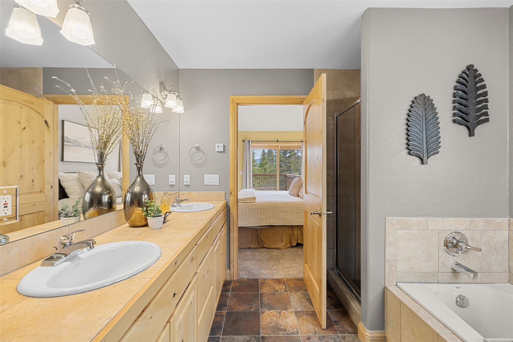 91795 Ryan Gulch Road Silverthorne, CO 80498 - Photo 26 of 50 a bathroom with a tub sink and mirror