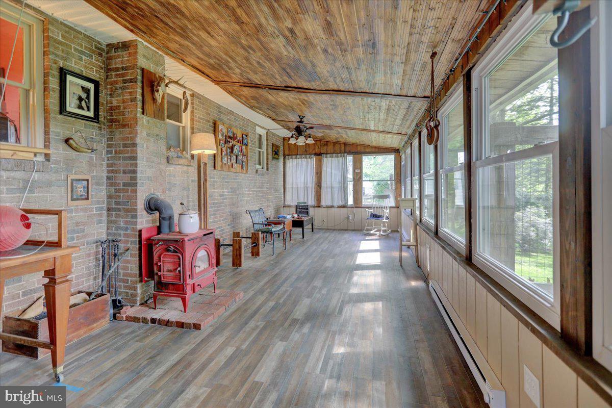 866 Kimmerlings Road Lebanon, PA 17046 - Photo 16 of 33 Sunroom w/wood stove