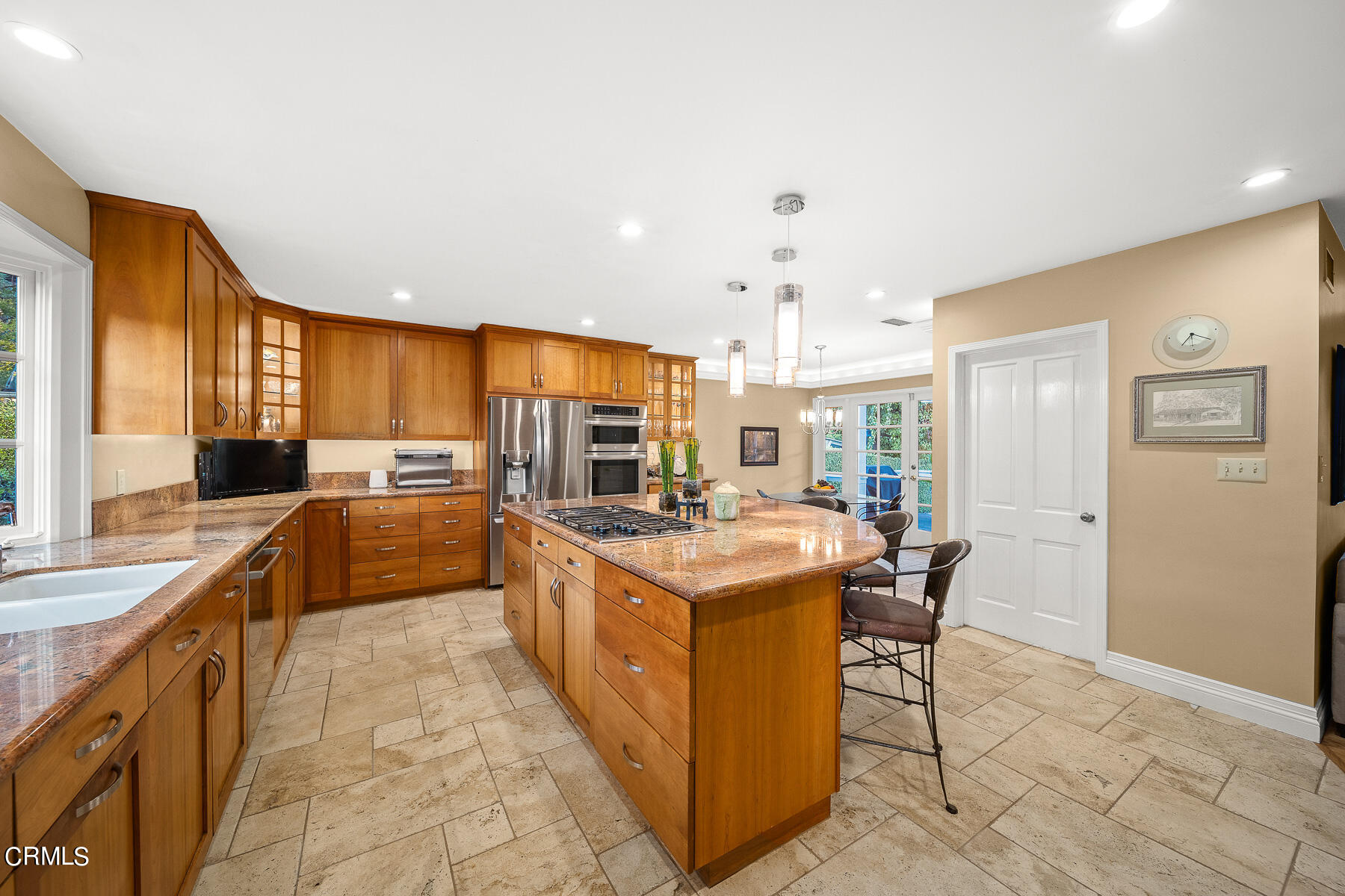 3780 Fairmeade Road Pasadena, CA 91107 - Photo 13 of 73 a kitchen with stainless steel appliances granite countertop a stove top oven a sink dishwasher and a refrigerator with the cabinets