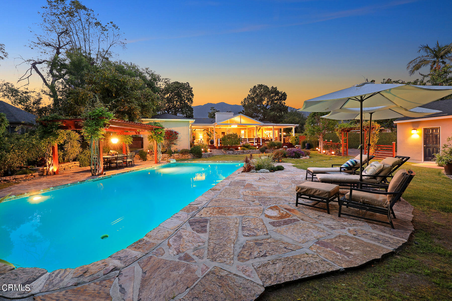 3780 Fairmeade Road Pasadena, CA 91107 - Photo 42 of 73 a view of a patio with table and chairs under an umbrella