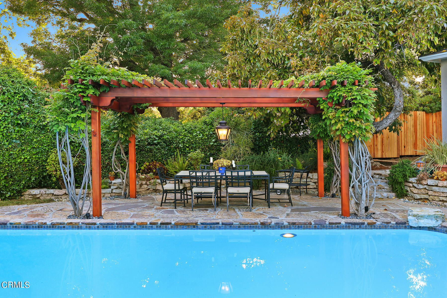 3780 Fairmeade Road Pasadena, CA 91107 - Photo 58 of 73 a view of a patio with table and chairs potted plants and palm tree