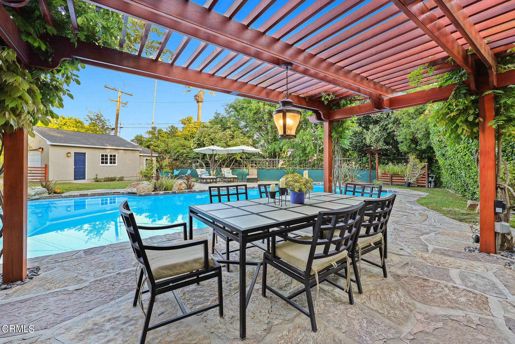 3780 Fairmeade Road Pasadena, CA 91107 - Photo 59 of 73 a patio with a table and chairs and potted plants